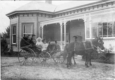 Image: Ladies and children in one-horse buggy.