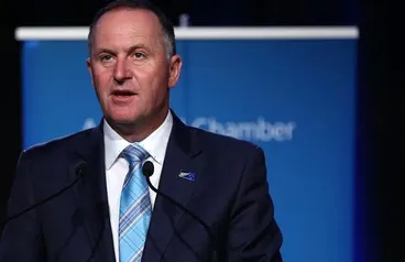 Image: John Key wearing Silver Fern flag pin