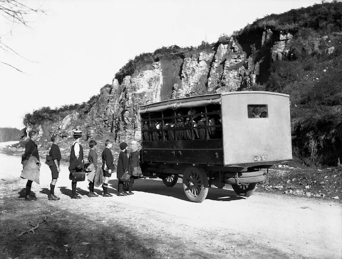 Children boarding a Department of Education school bus