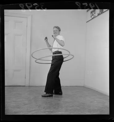Image: Mr C Matthews, demonstrating Hula hoops, unknow location