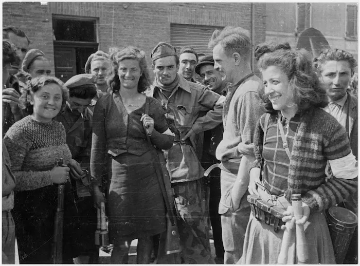 New Zealand troops talking with partisani women in the recently captured town of Massa Lombarda, Italy