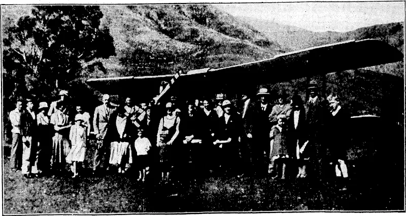 Photo, by courtesy Flight-Lieut. Bolt. FIRST AEROPLANE IN PELORUS SOUND.—'A Wellington Aero Club aeroplane, with Flight-Lieutenants G. Bolt and A. W. Nisbet, this week made the first landing in Pelorus Sound, at Manaroa Bay, where there is a natural runwayJOO yards in, length. The telephones were,*busy. quickly andl ~settUrs^atfar^j«mi * considerable distance about <Marwma:jßay+ (Evening Post, 21 October 1933)