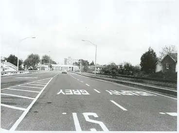 Image: The road approach to the recently completed Claudelands Bridge, with the State Advances building in the background, Hamilton