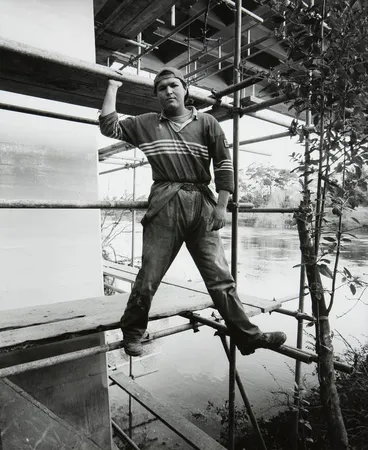 Image: Andrew, contract worker, repairing undercarriage of the Fairfield Bridge, Hamilton
