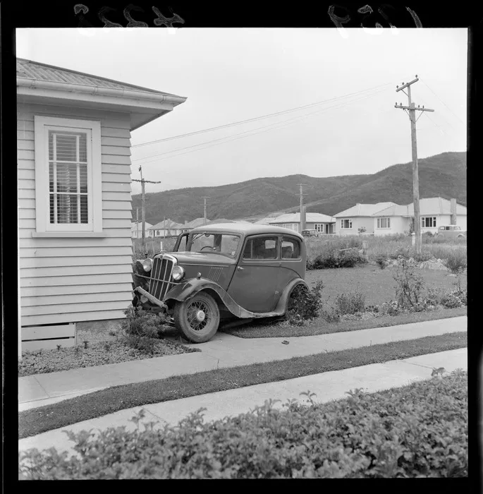 View of a car crashed into the Mackley house, Wellington