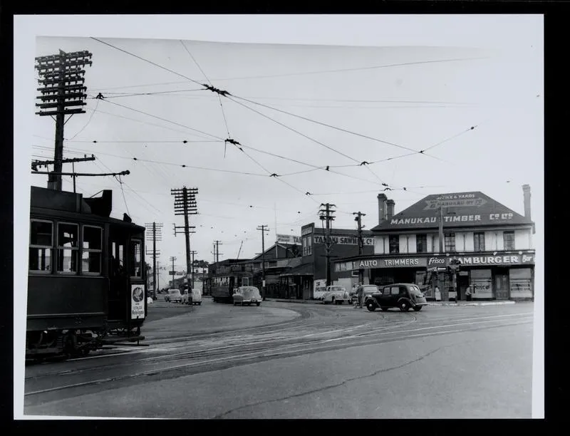 Trams and cars at intersection of Manukau Road