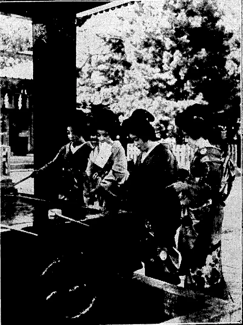 Sport and General" Photo. AT THE ENTRY TO, A JAPANESE SHRlNE.—Japanese girls carrying out the time-honoured custom of washing their hands before entering the shrine at Hikawa, Akaska. •_ "■ > ; (Evening Post, 28 November 1933)