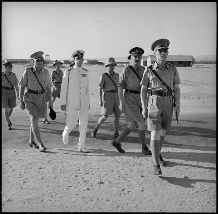 King of Greece arriving at a parade in Helwan
