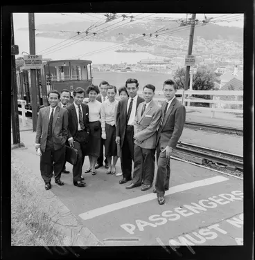 Image: Colombo Plan students from Asia, waiting at one of the stops on the cable car route, Kelburn, Wellington