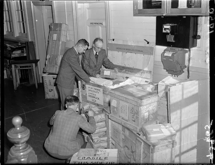 Correspondence School staff pack materials for exhibition