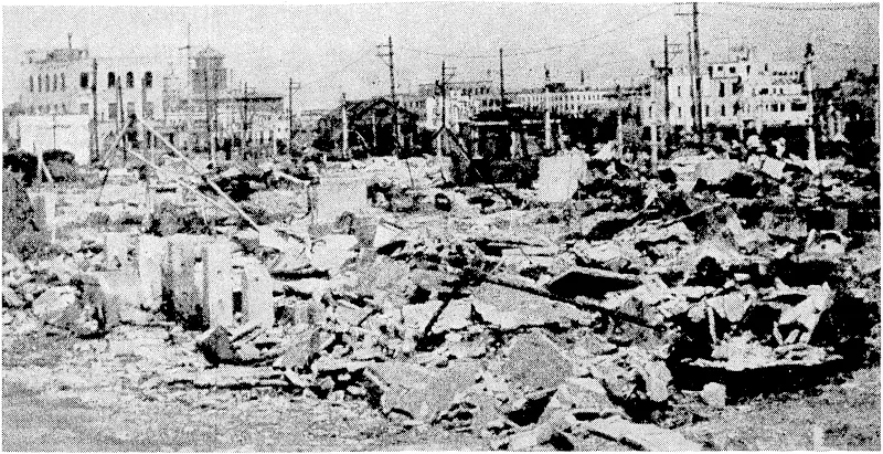 Commonwealth Department of Information Photo. The industrial city of Yokohama was very heavily bombed with incendiaries during early attacks on Japan, and great areas were completely burnt out. The only buildings left standing ivere those designed to be earthquake-proof, and even some'of these were severely damaged. On the burnt-out sites the inhabitants built shanties from the ivreckage. (Evening Post, 14 September 1945)