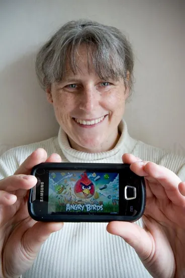 Gaming on a mobile phone, 2011 Image: Gaming on a mobile phone, 2011