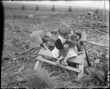 Image: Young girl with a puppy at Broadlands, 1910