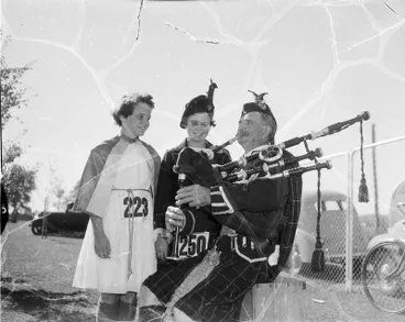 Image: Veteran piper and dancer, Mr Robert Mosgiel Burns, who is attending the Highland Games at Hastings for the ninth time, plays for his grandchildren