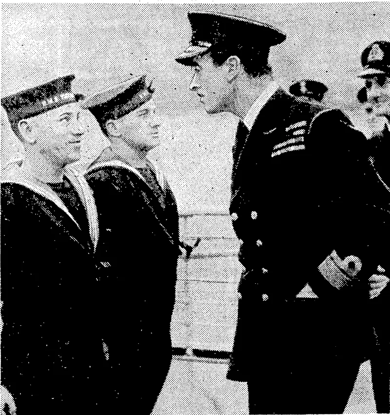 Lord Louis Mountbatten, popular British Admiral, upon whom has fallen^ the task of driving the Japanese from occupied territory in South-east Asia, questioning naval personnel who had participated in a commando raid. (Evening Post, 13 November 1943)