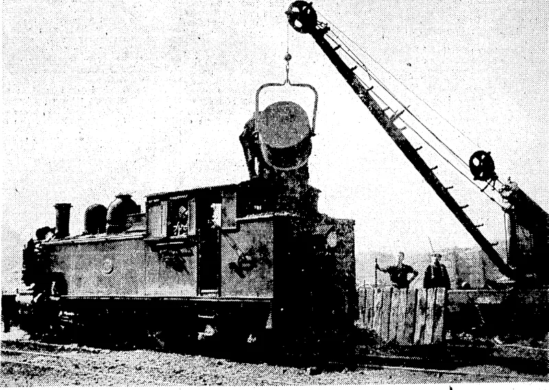 Evcnlnc Tost" Photo. Modern Methods in the railway coalyardii at Wellington. A stationary engine hauls the coal up the incline, a portion of which is seen on the left iri the lop picture, whence it is tipped direct, into the locomotive's tender from the adjustable shoot on, the right, a much quicker and more convenient.method . . than the old: system of' cqalingi.shoiyn in[the...lower picture.. . . . (Evening Post, 25 March 1938)