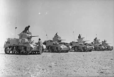 Image: World War 2 Honey tanks of the New Zealand Divisional Cavalry lined up at the end of a patrol, Alamein, Egypt