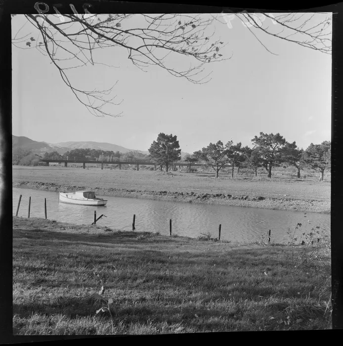 Boat on pond in park, Gear Island, Petone, Wellington Region, including Waione Street bridge