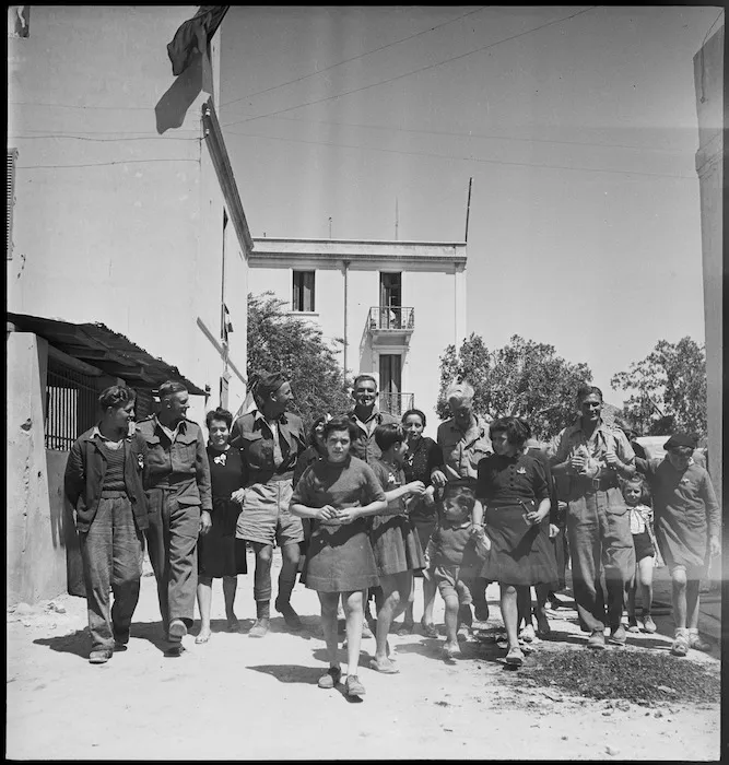 New Zealanders with the children of Sousse, Tunisia, in World War II - Photograph taken by H Paton