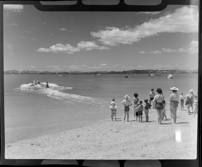People watching a water skier at Maraetai beach, Auckland