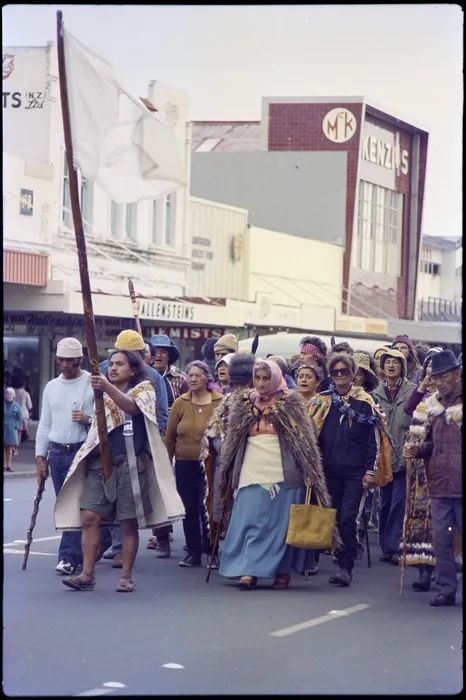 Tame Iti holding pou whenua, accompanied by Whina Cooper, leading Māori Land March along Hamilton street