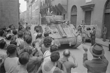 Image: Kaye, George, b 1914: New Zealand tank being greeted by citizens of Florence