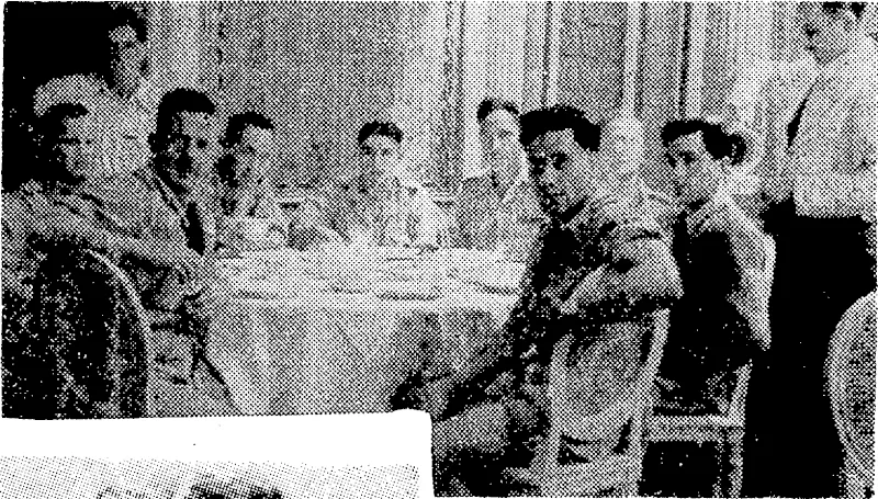 A dinner party in the Hotel Daniell, one of the leading hostelries of Venice, noiv being used as a New Zealand Forces Club. Seated at the table, from the left, are M. Hope and H. K. Beban (both of Lower Hutt), J. W. Yates (Hamilton), R. N. Thomson (Gisborne), B. Harold (Wairoa), S. White (Gisborne), A. Keefe (Wairoa), C. S. Apanui (Opotiki). Standing at the back, D. J. Richmond (Wellinglon). (Evening Post, 30 August 1945)