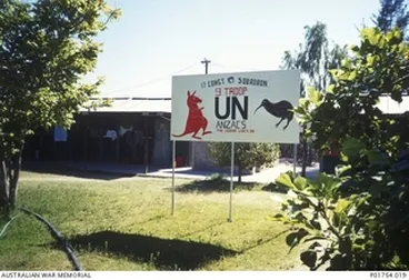 Image: Ondangwa, Namibia, 1989-12-07. Sign outside the quarters occupied by 9 Troop, 17 Construction Squadron, Royal Australian Engineers (RAE), United Nations Transition Assistance Group (UNTAG), at the ..