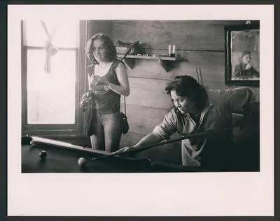 [Two Highway 61 associates play pool at the Auckland Headquarters]