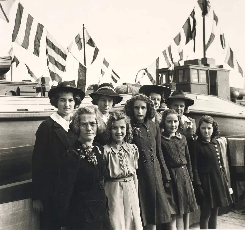 Daughters of shipbuilders at boat launching, Auckland, August 1944.