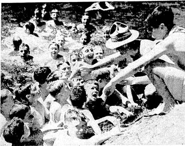 Image: Evening Post" Photo. Students attending'Rongotai College are holding their annual camp at Karapbti, in the Akatarawa district. Above, a popular pastime called jeeding the ducks." Top right, a cure for sunburn. Right, a spell among.the swimmers. (Evening Post, 15 January 1938)