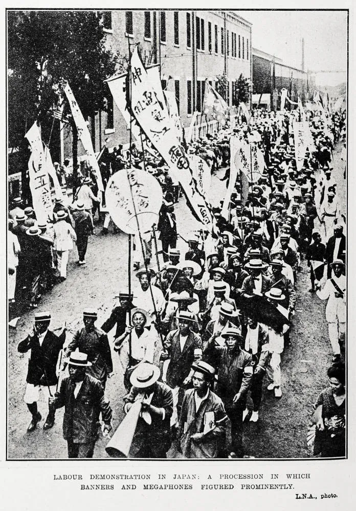 Labour demonstration in Japan: a procession in which banners and megaphones figured prominently