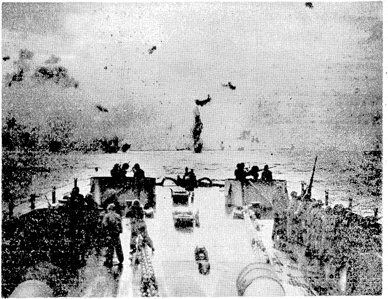 An attacking Japanese bomber crashes into the sea- after a futile dttempt to attack American carriers, off Okinawa. (Evening Post, 30 June 1945)