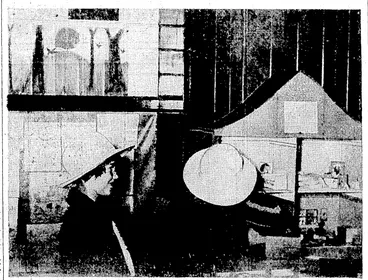 Image: IIIL LL,.*L 01 THE DOLL'S HOtJSE.—-Children admiring*a doll's house which'is among: the displays at the exhibition of work done by Correspondence School pupils, opened this morning by the Hon. Peter Fraser, Minister of. Education? in the old Terrace School building^ Clifton Terrace.. (Evening Post, 12 May 1936)