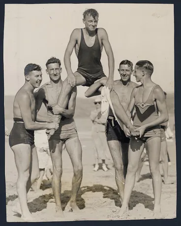 Image: Mr J Clark of Maranui Life Saving Club being carried by clubmates, Lyall Bay