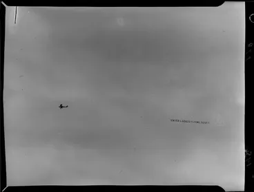 Image: Banner with words 'Enter ladies flying test' being flown around Wellington by the Wellington Aero Club