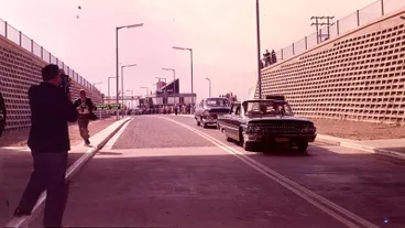 Image: Fletcher Holdings Ltd: 27Feb1964 The Governor-General, Sir Bernard Fergusson's car enters the Christchurch-Lyttelton Road Tunnel on the first run through on the official opening day