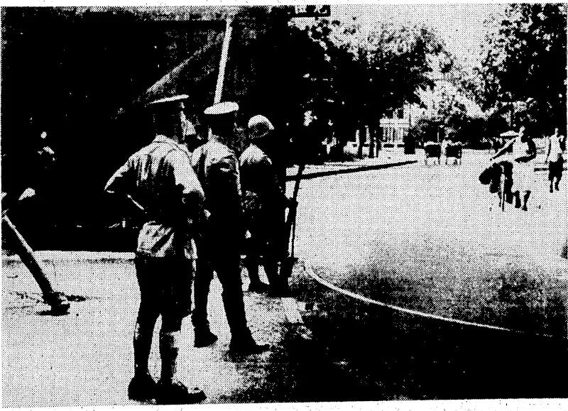 Sport;and■ General*; Photo* ■Japanese, soldiers}* assisted by police, from. the. Legation& Quarters, ■^i^d^g:'tkeil^^hl(^e\.ofrikerXegathn>area:at(S^hgKm/'.at'rthe; •commencement of. the present trouble. (Evening Post, 11 September 1937)