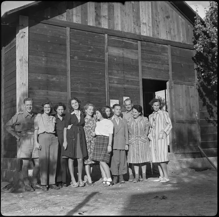 Captain R Dawson with hospital staff drawn from refugees at former POW camp near Bari, Italy - Photograph taken by W A Brodie