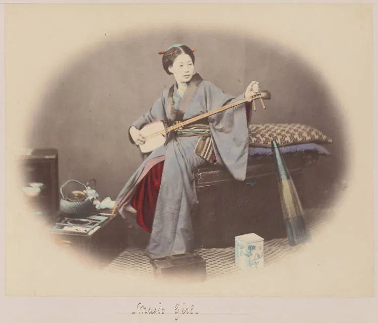 Japanese woman holding a shamisen