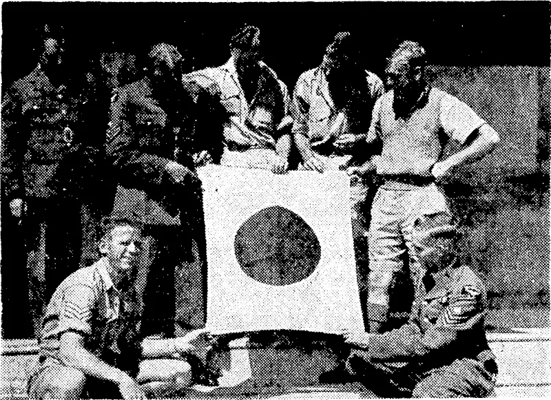With a Japanese flag secured in the Solomons, these R.N.Z.A.F. members are enjoying a period of rest at a New Zealand station after a strenuous spell of duty at a South Pacific air base. (Evening Post, 08 March 1943)