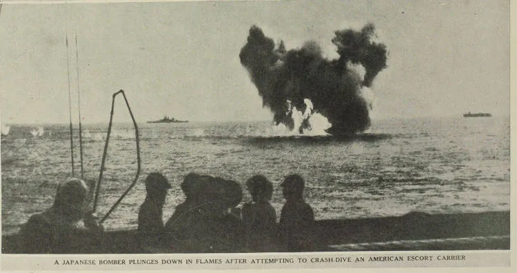 A Japanese bomber plunges down in flames after attempting to crash-dive onto an American escort carrier