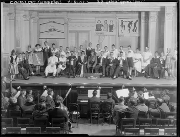Image: Students, including orchestra, in a theatrical production [Flashlight?] at Christ's College, Christchurch