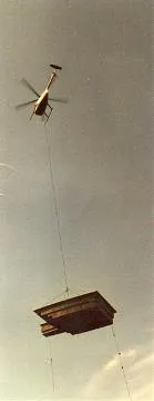 Helicopter delivering swimming pool