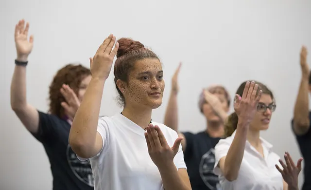 Students from Van Asch Deaf Education Centre perform national anthem