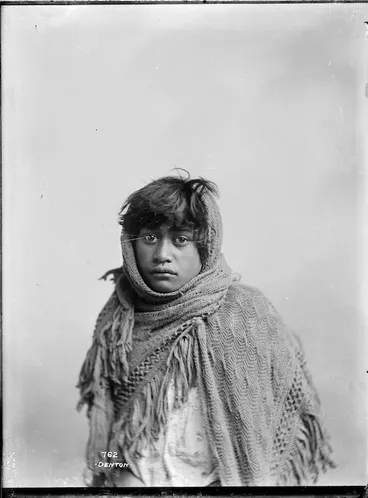 Image: Young Maori girl wrapped in a shawl - Photograph taken by Frank J Denton