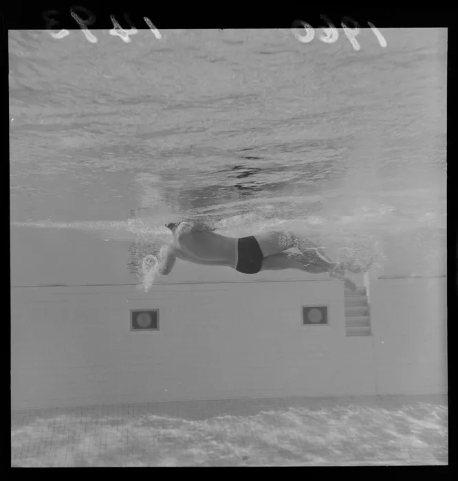 Peter Hatch, demonstrates swimming techniques at Naenae baths, Naenae, Lower Hutt, Wellington