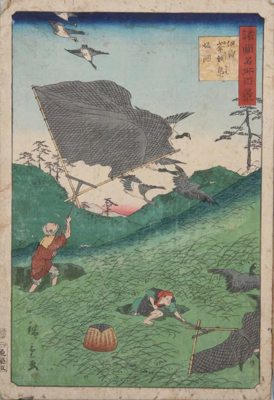 Two men in dugouts catching birds with nets.