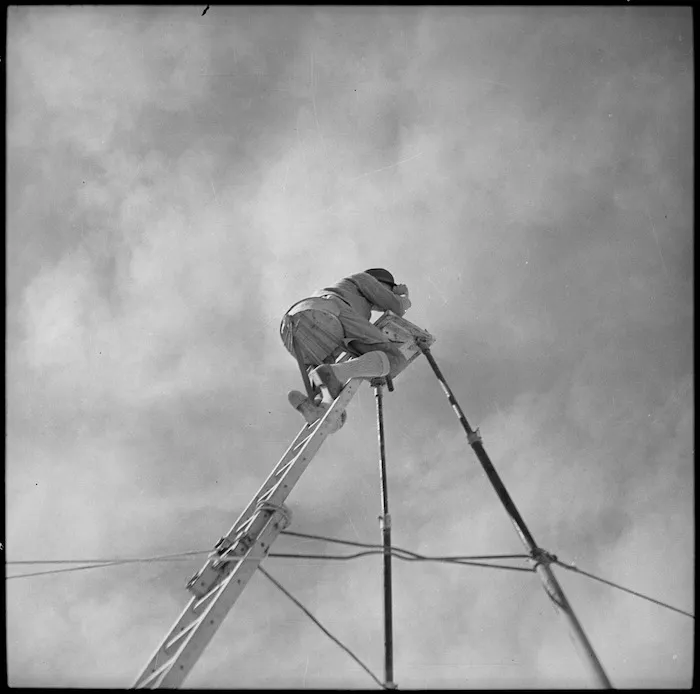 Artillery officer demonstrating the use of a light observation tower, Egypt