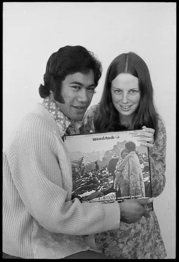 Image: Wellington pop singer Nash Chase and competition winner Pam McLachlan, with with a three record set of the motion picture Woodstock